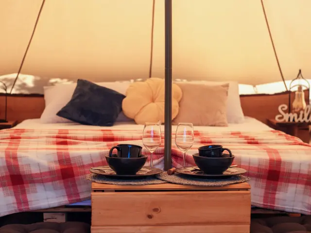 tent-interor-with-bed-dishes-glamping-1.jpg